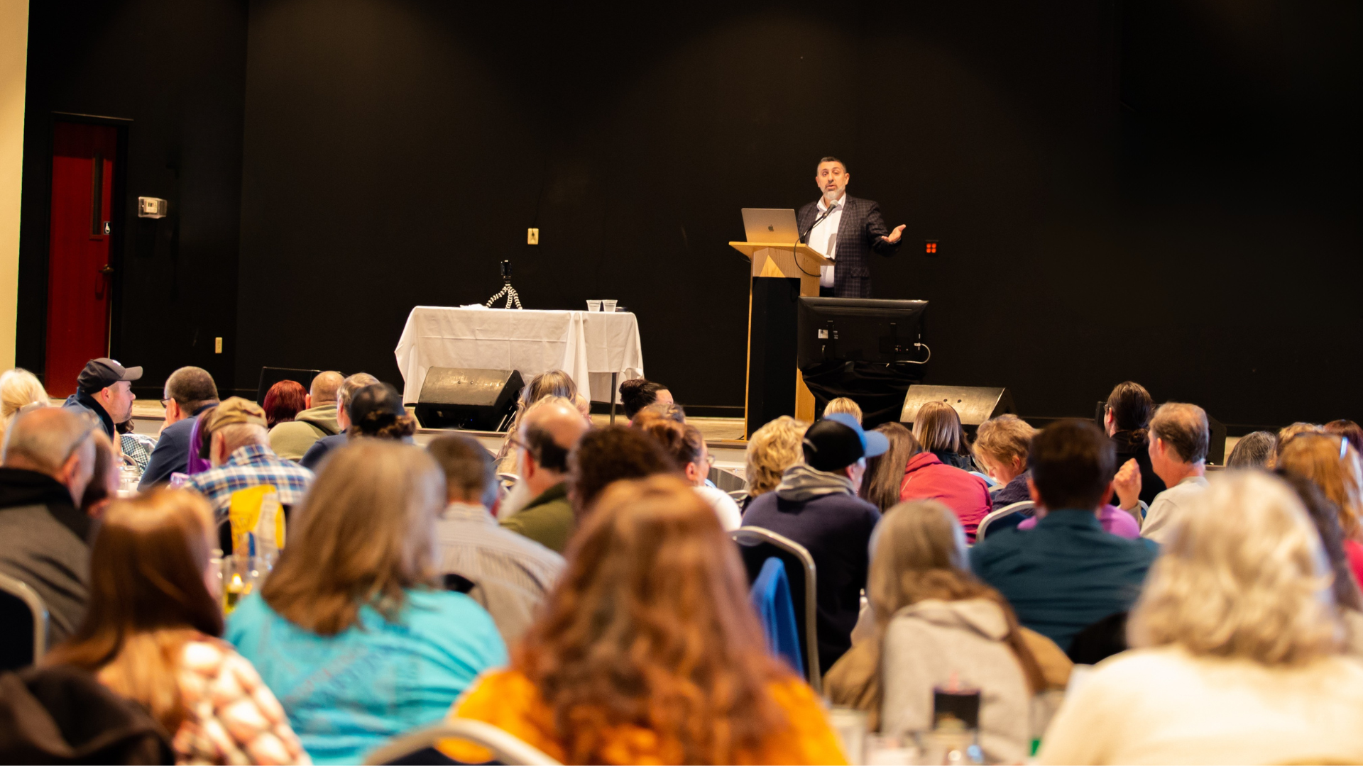 Romeo El Chaer speaking at a live leadership event